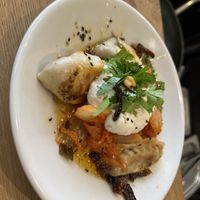 Nomadengelüste dumplings with kimchi and schmand on top  at Plagwitz Samstags Markt in Leipzig
