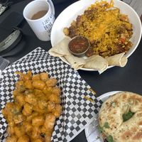 Death Free foodie sammy, scramble, and cheesy tots.  Soooooo good!  at Midtown Vegan Deli & Market in Tucson