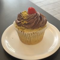 Houlden's pistachio raspberry cupcake  at Midtown Vegan Deli & Market in Tucson