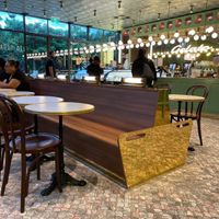 There are shining lights and lots of seats .  at Anita Gelato in West End