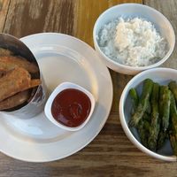 Sides: jasmine rice, grilled asparagus, and wedges potatoes   at Sea Breeze in Noord