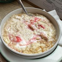 Rhubarb & ginger porridge with coconut yogurt and crumble!  at Flour House in Bristol