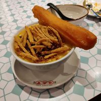 Pumpkin congee with vegan egg and youtiao at The Hainan Story 海南寶 -Jln Sultan in Central Singapore
