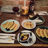 Greek olives, pita bread and fava. Wine was vegan too! at Restaurang Mediterranean in Lund