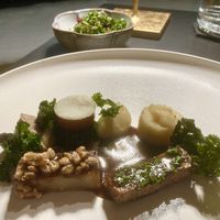 Main course of celeriac, horseradish and kalettes with kale salad  at Glacier Fine Dining in Grindelwald
