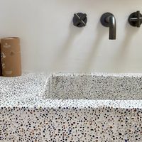 lavatory with eco friendly vanity sets. sink made out of recycled glass at Ethos Vegan Suites in Santorini