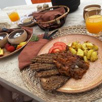 Aubergine and tomato and roasted potatoes, and chocolate and coconut pudding   at Ethos Vegan Suites in Santorini
