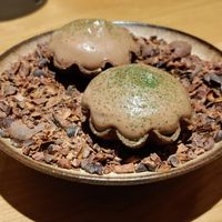 Chocolate mousse cup with green herb gel on the base at JOLA in Vienna