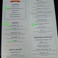current food menu (8/25): "x" for veganizable, "(v)" for vegan at MADONNA in Amersfoort