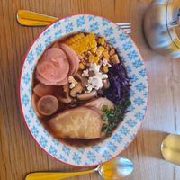 Bland vegan ramen w corn, root vegetables, shitake, popcorn celery, red cabbage and noodles.  at Traders in Aarau