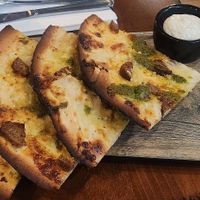 Pizza with pesto at The Volstead by Unity in Philadelphia