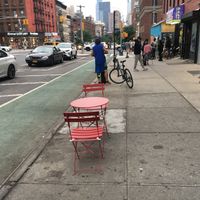 One of the two metal tables for outdoor eating at Plant-Blossom in New York City