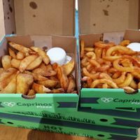Wedges and curly fries at Caprinos Pizza in Leicester