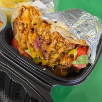 Vegan Buffalo Chickn Wrap with everything 🔥 at Palm Tree Caribbean Cafe in Hampton