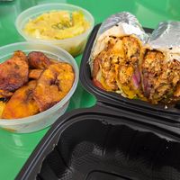 Vegan Buffalo Chickn Wrap with extra sides - cabbage and plantains 🤩 at Palm Tree Caribbean Cafe in Hampton