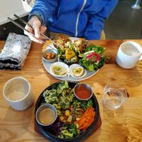 My marinated tofu bibimbap and my omnivore friend's bento. We both got the hot cardamom chai. Delicious on a freezing day! at Made in House in Seattle