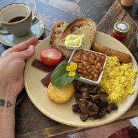 Full Venglish (£12 sausage, bacon, scrambled tofu, tomato, mushroom, hash brown, baked beans and toast) + black coffee (£3)  at Cafe@62 in Brighton