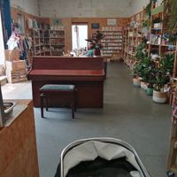 Indoor seating plus shop shelves selling plants, eco make up, stationery, second hand clothes, gifts etc at Two Old Goats  in Market Harborough
