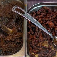 spinach, chickpeas, eggplant, tempeh, and cabbage at Roti huis Leiden in Leiden
