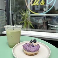 Raw blueberry tart and matcha latte with oat milk. They have almond and soy milk options, too.  at lu & i in Montreal