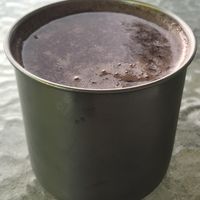 Cup of grape juice came with menu of day    at Tulia in Medellin