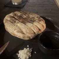 Bread with olive oil and salt  at kitchen table in Tulum
