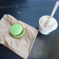Half pistachio half hazelnut in a cup plus a pistachio macaron at Moo Moo Isbar - Nordhavn in Copenhagen