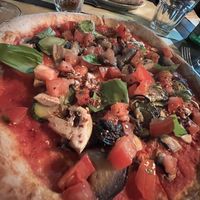 Closeup of the vegan pizzaa  at Spaccio Alimentare in Florence