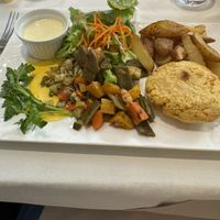 Potato and lentil patty with veggies   at Le Pommier in Bayeux
