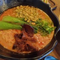 Ramen with incredible lemongrass, coconut milk with a kick of spice sauce.  The corn is a nice touch. at House of Vegano in St Petersburg