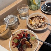 plum crumble and snickers porridge. iced latte was good but charged extra for plant milk  at Fågel by artizán in Budapest
