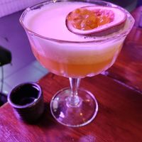 Passion fruit cocktail and shot of sake. Come 5-6pm for 2 for 1 special! at Bonsai Plant Kitchen in Brighton