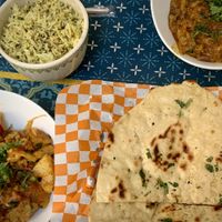 We ordered samosas (not pictured…large size) buttered garlic naan, aloo gobi, baigan bartha and rice. Big enough portions for two people to share.  at Red Indian Chilli in Oaxaca