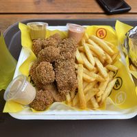 nuggets, tenders with mustard, spicy sauce and smokey sauce   at La ReContra in Lima