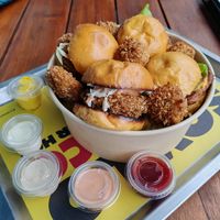 Four mini burgers (the crispy and bacon and cheese) at La ReContra in Lima