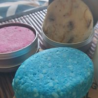 Pink: shampoo, blue: balsam, beige with orange stripes: shampoo at LUSH - Westfield Mall of Scandinavia in Solna