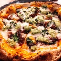 Pumpkin Pizza with avocado pesto and caramelized onions at Pianta in Bogota