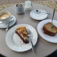 Vegan snickerscake and banana bread with cappuccino with soy 'milk'. at Café Mia in Lemgo