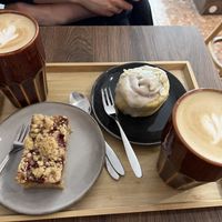 Flat whites, cinnamon roll, and berry-streusel cake  at My Mom's in Salzburg
