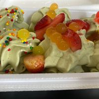 Pistachio-almond yogurt with sprinkles, tapioca balls, fresh strawberries and passion fruit jam. at Summer Love in Tel Aviv