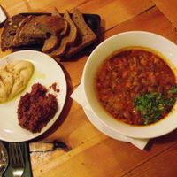 Freshly baked bread with hummus,olive paste and beans soup at Sunmoon - Alabin in Sofia