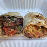 vegan burrito:
Black bean spread, salsa, cheddar, beyond sausage, JUST egg patty, paprika aioli

potato burrito:
Home fries, black bean spread, fajita veggies, salsa, paprika aioli at Prince Street Cafe in Lancaster