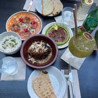 Two cold mezze (hummus and heirloom tomato and watermelon ceviche), vegan soy and orange roasted cauliflower  at Twentysix in Budapest