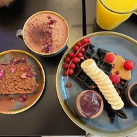 Banana bread, creamy black waffle, and almond milk Açaï hot chocolate   at Açaï & You - Rue Dauphine in Paris