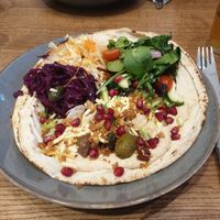 Flatbread with Hummus, Pomegranate, Olives, Toasted Pumpkin Seeds, Vegan Cheddar at The Peddle in Whitehaven