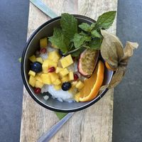 Surprise dessert compliments of the chef-it was so good! Coconut rice with delicious fruits and mint. Patrick, the owner/chef was really great!   at Angkoon in Klagenfurt