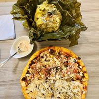 Tamal & no chicken pizza  at Marvelous Vegan Plant Power Food in Bogota