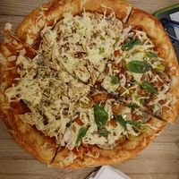 Half neopolitan, half seitan and mushroom. at Marvelous Vegan Plant Power Food in Bogota