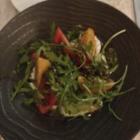 Heritage tomato salad with vegan feta, rocket and basil pesto   at Zacry's in Newquay