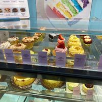 Vegan cupcake selection on the top shelf at Lola's Cupcakes - Canary Wharf in East London